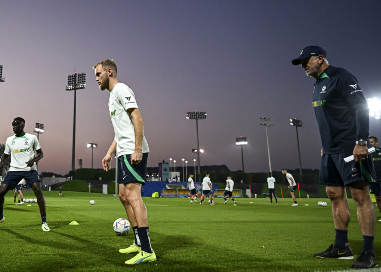 Australia's coach Graham Arnold (R) heads a training session at the Aspire Academy in Doha on November 20, 2022, ahead of the Qatar 2022 World Cup football tournament. (Photo by CHANDAN KHANNA / AFP)